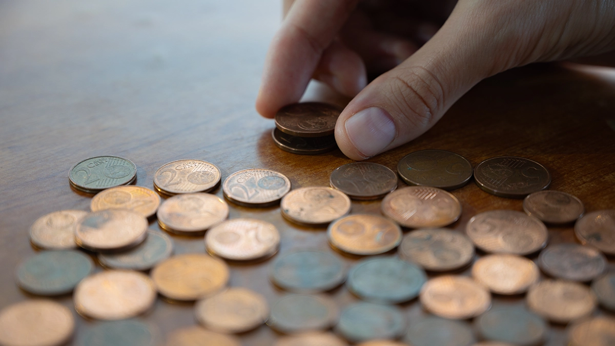 This is an image of a pile of discontinued euro cents and euro two-cent coins.