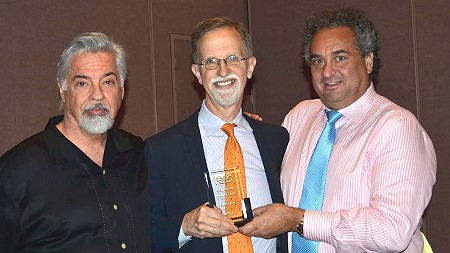 Steve Ivy (center) is inducted into the PCGS CoinFacts Coin Dealer Hallof Fame by David Hall (left), Co-Founder of PCGS, and Kevin Lipton (right) on August 8, 2014 at the ANA World's Fair of Money.  (Photo by Donn Pearlman.)