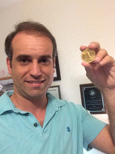 Josh holds up his newly-purchased 1910 Saint-Gaudens double eagle.