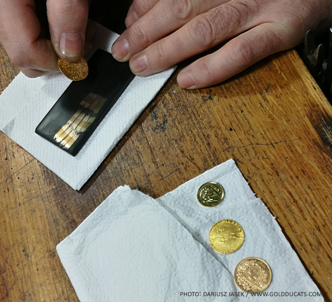 Testing coins using a touch stone and karat needles. Image courtesy Dariusz F. Jasek