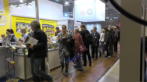 A crowd gathers at the German Post Office Booth at the Berlin World's Money Fair in 2017