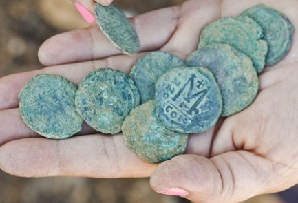 Bronze Byzantine coins discovered in Israel. Photo courtesy Yoli Shwartz | © Israel Antiquities Authority (IAA)
