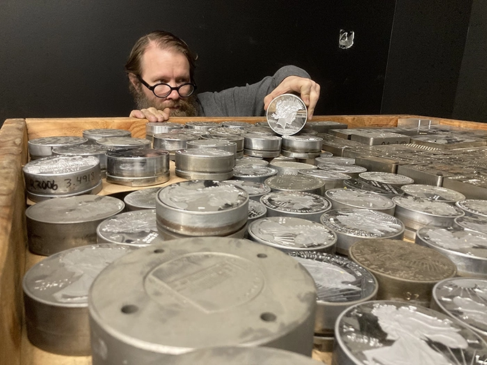 Figure 5. Jesse with a pallet of dies and hubs. Image: American Numismatic Society.