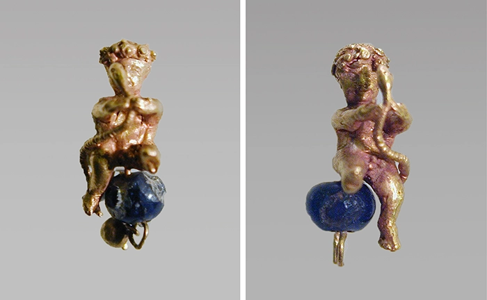 Figure 4. Pair of gold and glass earrings with baby Herakles, 2nd–1st c. BCE, (Metropolitan Museum of Art 1999.289.11a, b). 