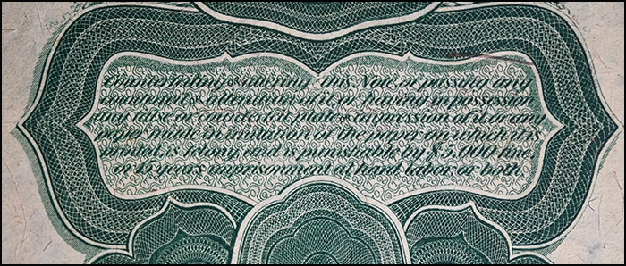 Anti-Counterfeiting Warning on a Series 1869 $2 Legal Tender Note. Image: CoinWeek.