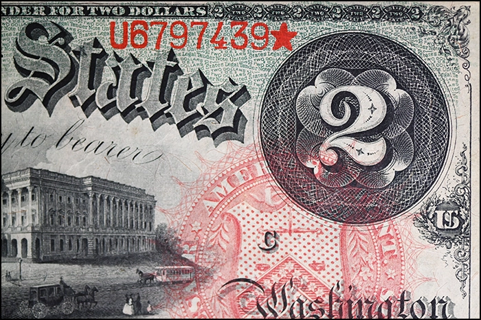 Series 1869 $2 Legal Tender Note. Obverse close-up showing guilloché engraving surrounding a large number 2. Image: CoinWeek.