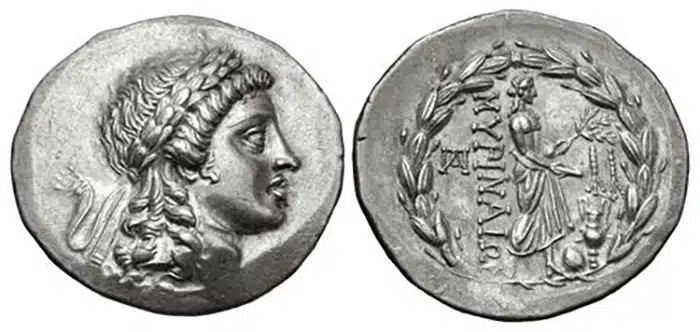 Figure 9: AIOLIS, Myrina. Circa 160-143 BCE. AR Tetradrachm. Stephanophoric type. Laureate head of Apollo right / Apollo Grynios standing right. Holding branch and phiale; monogram to left, omphalos and amphora at feet; all within laurel wreath, 33mm. 16.70 g., Sacks Issue 20, Obv. die 19. (CNG 476, Lot 101, $1700, 9/9/20).
