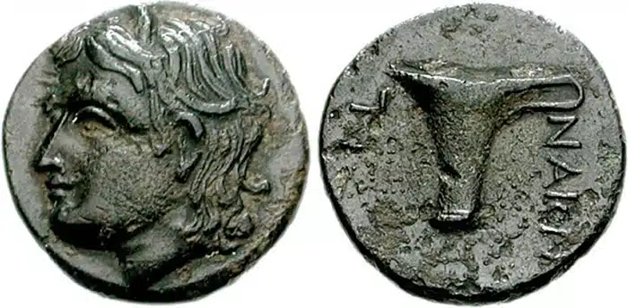 Figure 9: AEOLIS, Tisna. 4th century BCE. Æ 16 mm. Head of river god Tisnaios left / One- handled cup, TIS-NAION, 3.45 g., SNG Copenhagen 283. (CNG 76, Lot: 693, $350, 9/13/07).