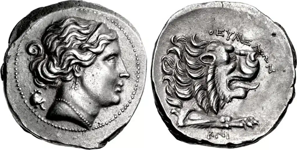 Figure 9: Knidos, CARIA. Circa 350-330/20 BCE. AR Tetradrachm. Theumelon, magistrate. Head of Aphrodite right, hair tied at back, wearing stephanos, triple-pendant earring, and pearl necklace; behind neck, Phrygian helmet right / Forepart of lion right; ΘEYMEΛΩN to upper right, KNI below, 27.5mm, 15.00 g. Ashton, Late 14 (A8/P14). (CNG 105, Lot: 371, $16,000, 5/10/17).