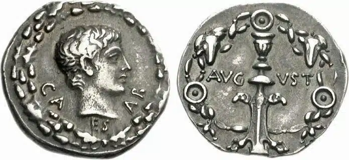 Figure 9: Augustus. 27 BCE - 14 CE. AR Denarius. Uncertain eastern mint. Struck circa 12 BCE. Youthful, bare head right; all within oak wreath CA-ES-AR / Candelabrum ornamented with rams’ heads; all within a floral wreath entwined with two bucrania and three pateras AVG-VSTI, 19mm, 3.84 g., RIC 1 540. (CNG 12, Lot: 781, $3250, 10/7/22).
