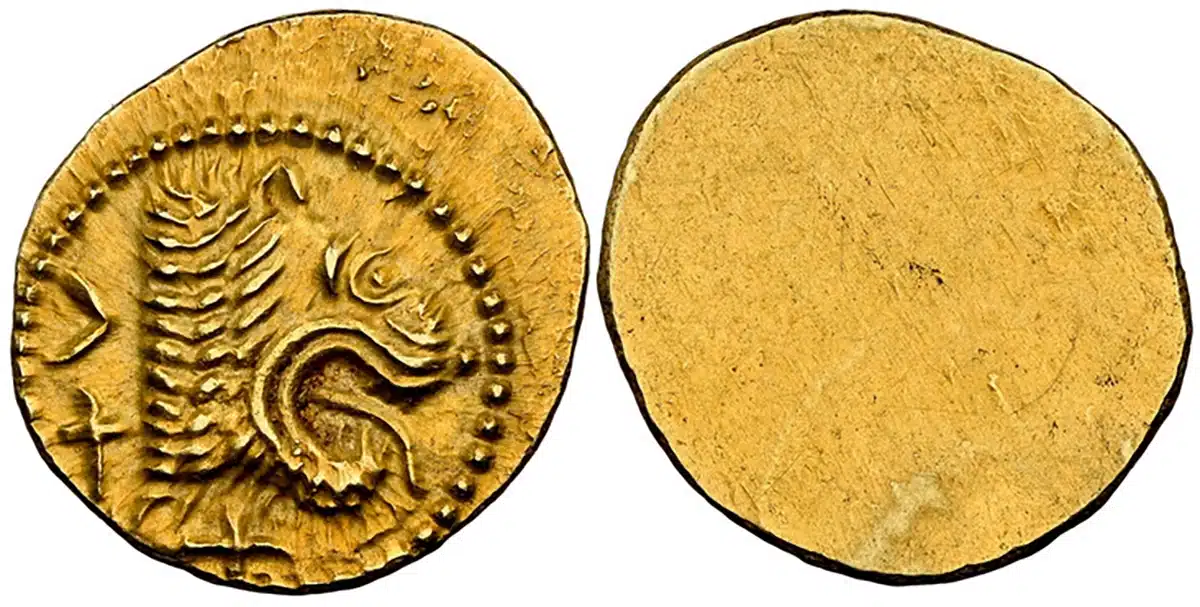 An eight sided antique brass token from Cliff's Place of Geneva