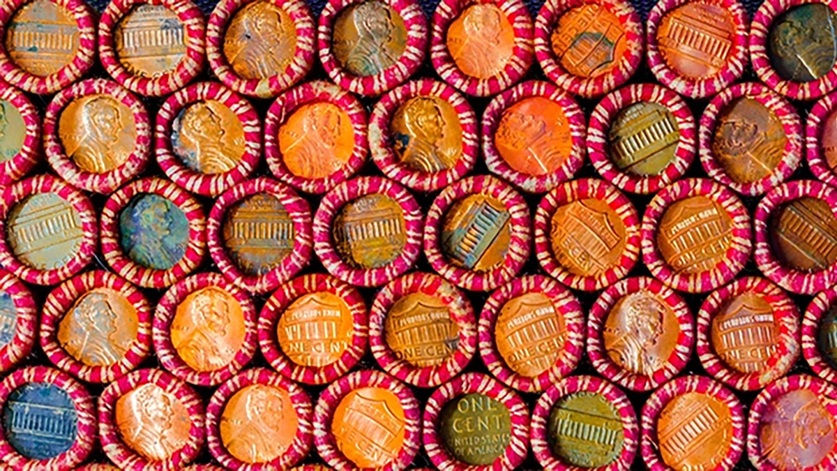 Unsearched rolls of one cent coins. Image: Adobe Stock.