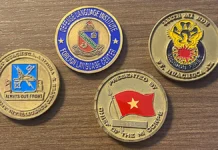 An assortment of challenge coins from Charles Morgan's personal collection.