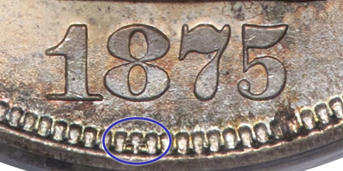 Close-up of the 1875-S Twenty-Cent FS-301 variety. The disturbed area in the denticles below the 8 is thought to be a misplaced date punch. Image: Heritage Auctions / CoinWeek.