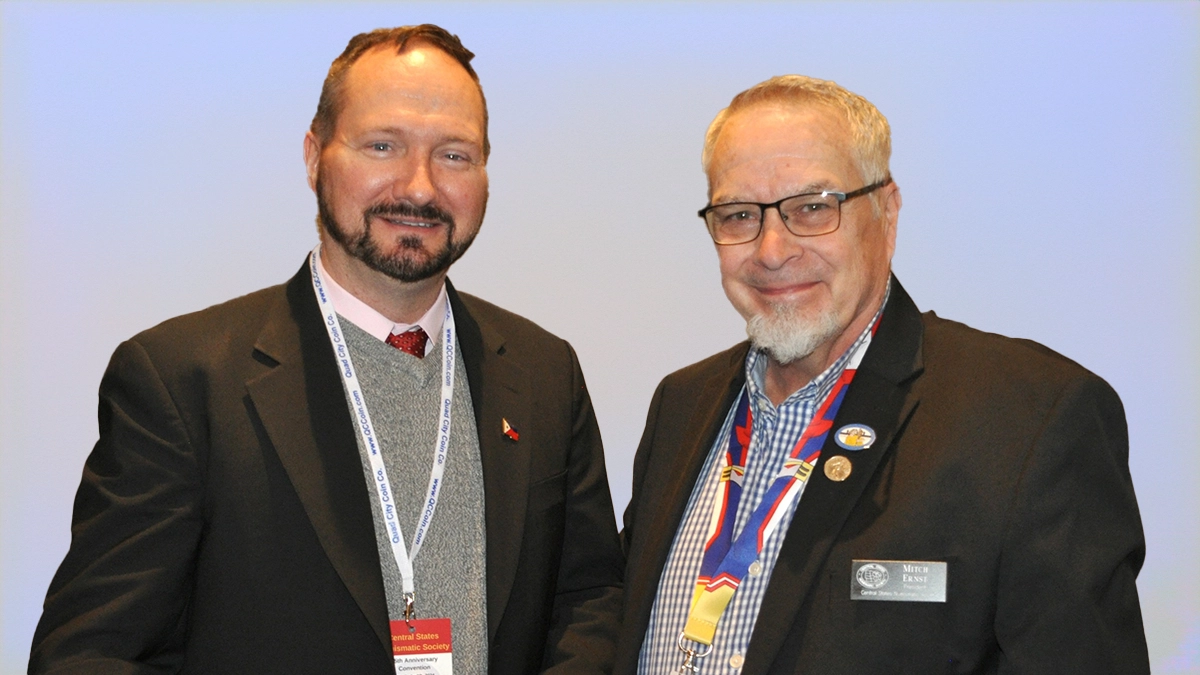 Dennis Tucker receives an award from CSNS. Tucker (left), Mitch Ernst (right).