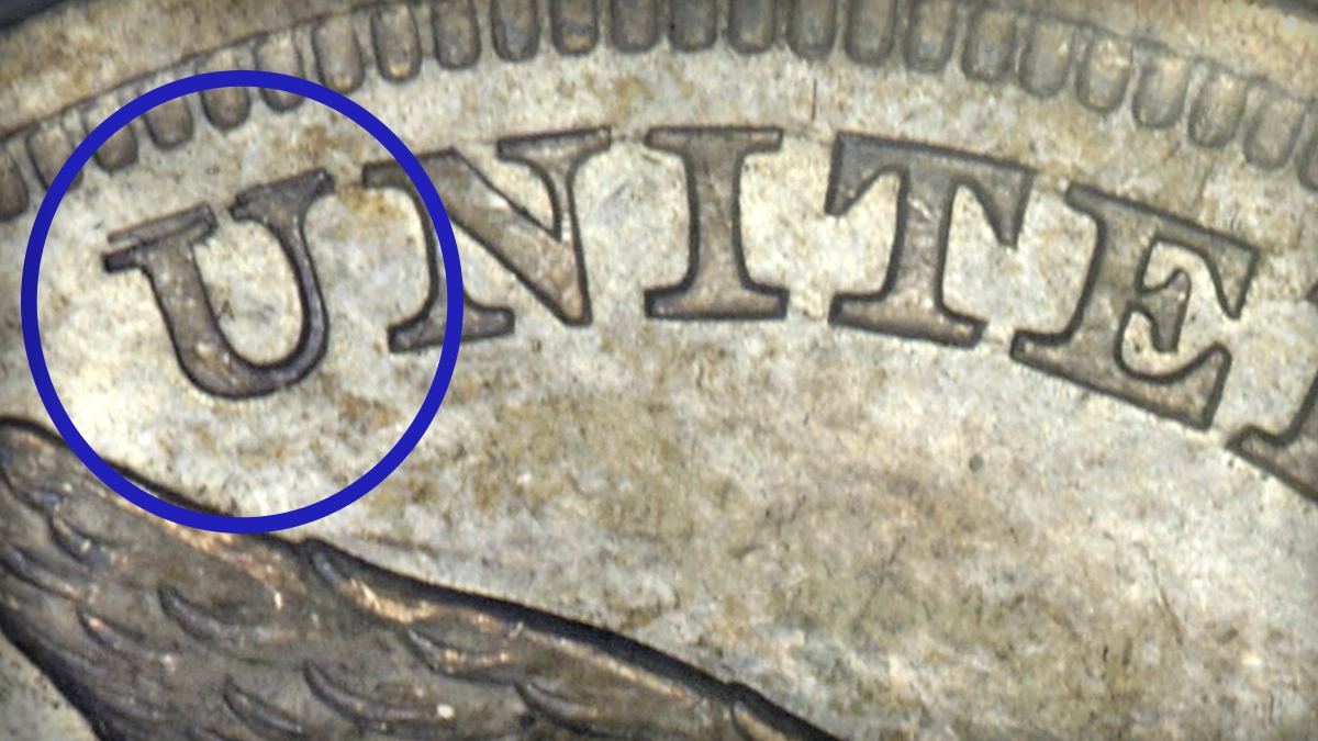1865 Liberty Seated Dollar, FS-801. Note the repunched U. Image: Heritage Auctions.