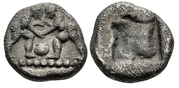 Uncertain. Early-mid 5th century BC. AR Diobol or Eighth Stater (?) (10mm, 1.24 g). Two wrestlers grappling; aryballos (?) between / Incuse square punch.. Toned, granular surfaces. VF. Extremely rare. Classical Numismatic Group Triton XXVIII 14 January 2025 Lot: 341 realized: $450 