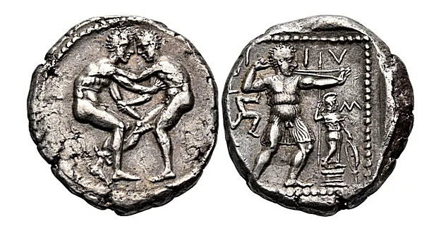 Aspendos. Circa 380-325 BC. Stater (Silver, 23 mm, 10.87 g, 12 h). Two wrestlers beginning to grapple with each other: the righthand one extends his right leg between his opponent's legs, grasps his right shoulder with his left hand and his left forearm with his right hand; the lefthand wrestler grasps his opponent's right knee with his left hand. Rev. [?S?]-??[?]-IIV-S Slinger striding right, t, triskeles to right; at the slinger's feet to right, statue of Athena on a low pedestal to right. SNG Copenhagen 436 Nomos Auction 32 8 June 2024 Lot: 116 realized: $6,134