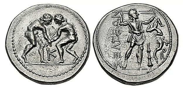 Selge. Circa 325-250 BC. AR Stater (24mm, 8.92 g, 1h). Two wrestlers, nude, grappling; K between / Slinger in throwing stance right; to right, triskeles above club and cornucopia. SNG BN 1947. Near EF. Well centeredClassical Numismatic Group Auction 129 13 May 2025 Lot: 287 realized: $1,000