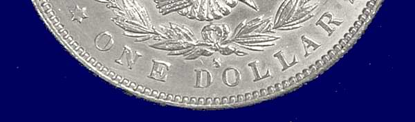 1889 Morgan Dollar has an embossed mintmark. At first glance, many wouldn’t pick up that there’s anything wrong with this coin