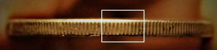 Take a careful look at the edge of this coin – note just to the right of center that the reeding looks a little off? That’s where the hole was filled in and fake reeding applied. Image courtesy PCGS.