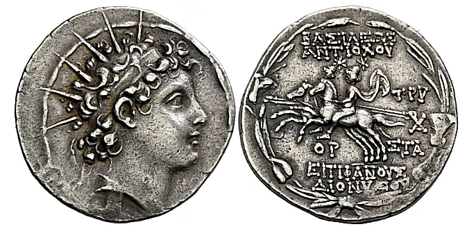 SELEUKID KINGS. Antiochos VI Dionysos, 144-142 BC. Tetradrachm (Silver, 31 mm, 16.71 g,),Antiochia on the Orontes, SE 170 = 143/2. Radiate and diademed head of Antiochos VI to right. Rev. ΒΑΣΙΛΕΩΣ / ΑΝΤΙΟΧΟΥ - ΕΠΙΦΑΝΟΥΣ / ΔΙΟΝΥΣΟΥ The Dioskouroi galloping left, holding lances; to right, TPY above monogram above ΣTA; below horses, OP; all within wreath of lily, ivy and grain leaves and ears. SC 2000.3d. Lightly toned and with an attractive portrait.
