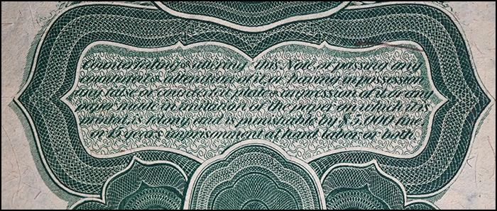 Anti-counterfeiting warning on an 1869 two-dollar Legal Tender Note.