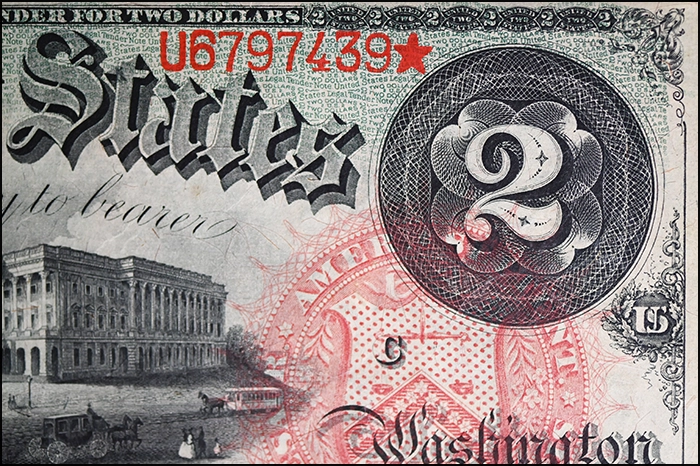 Guilloché security engraving on an 1869 Rainbow $2 bill.