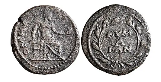 AEOLIS. Cyme. Pseudo-autonomous issue. Assarion (Bronze, 20 mm, 5.00 g,), time of Commodus, circa 184-190. OMHPOC Homer seated to right, holding scroll in his left hand and resting his right on seat. Rev. KYM/A/IΩN within oak wreath. BMC 109-110. RPC IV.2 online 2469. Extremely rare, apparently the fourth known example.