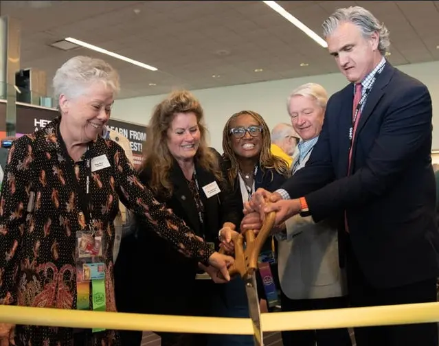 ANA Vice President Mary Lynn Garrett (second from left) and ANA Representatives (left to right) Donna Moon, Phyllis Ross, David Heinrich, and Seth Chandler cutting the ribbon to officially open the show.