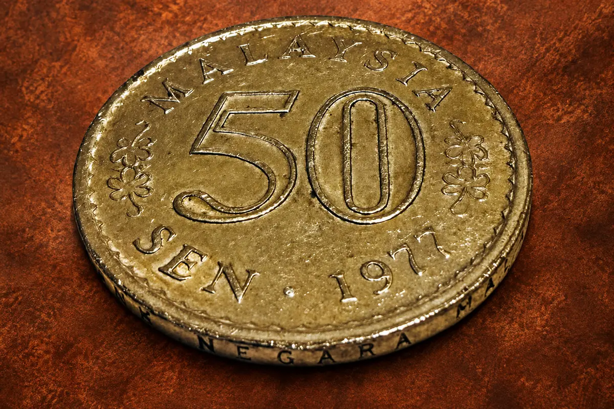 Here is the edge lettering on a Malaysia 1977 50 Sen: